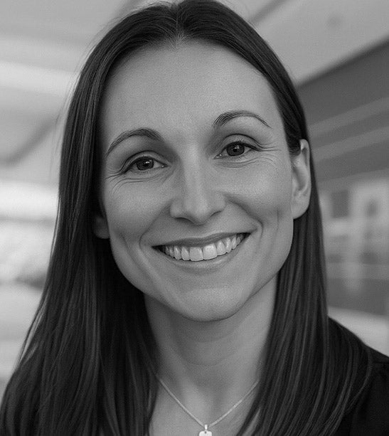 Black and white photo of a woman with a blurred background