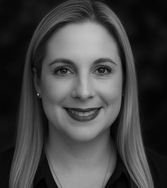 Black and white portrait of a woman with a blurred background