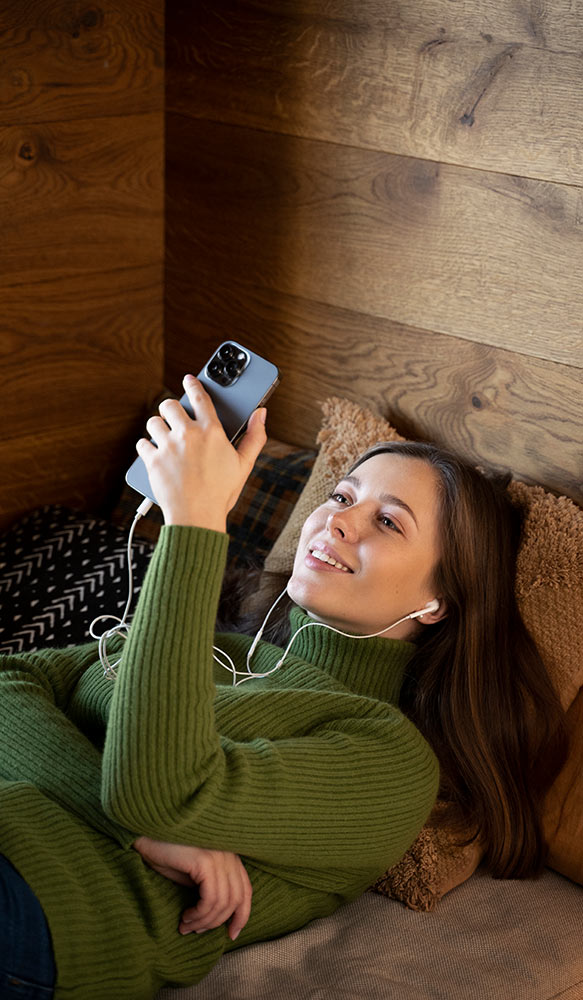 Lady on phone looking at vape strengths for her