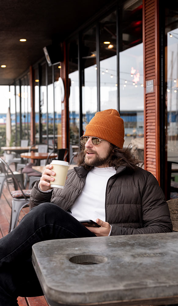 Man who has quit smoking and is enjoying a coffee