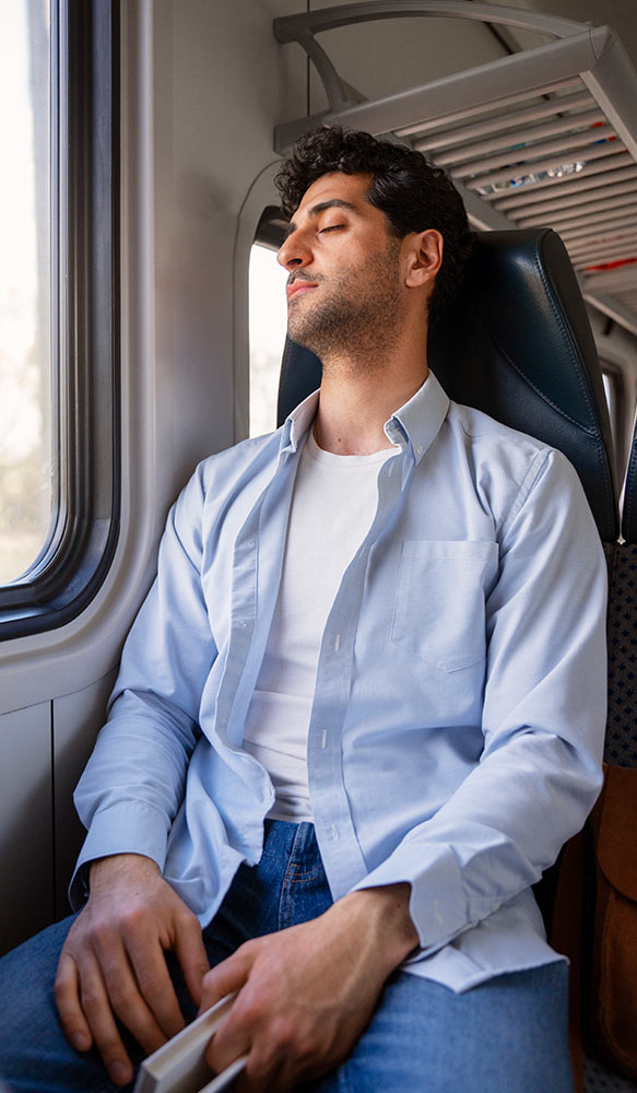 Man on a train who has just quit smoking