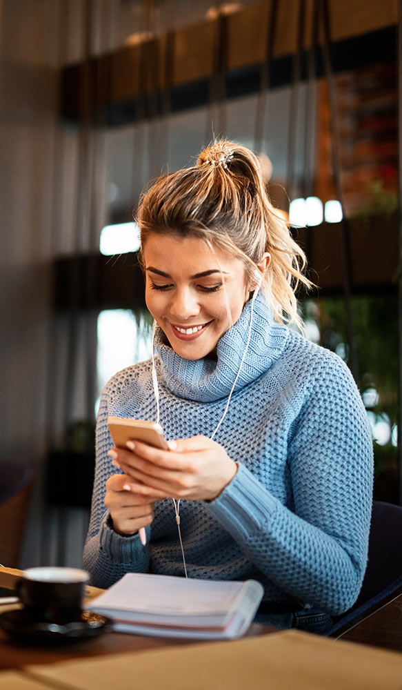Woman looking at Kicko on her phone